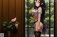 Anime girl with long black hair standing in front of a window.